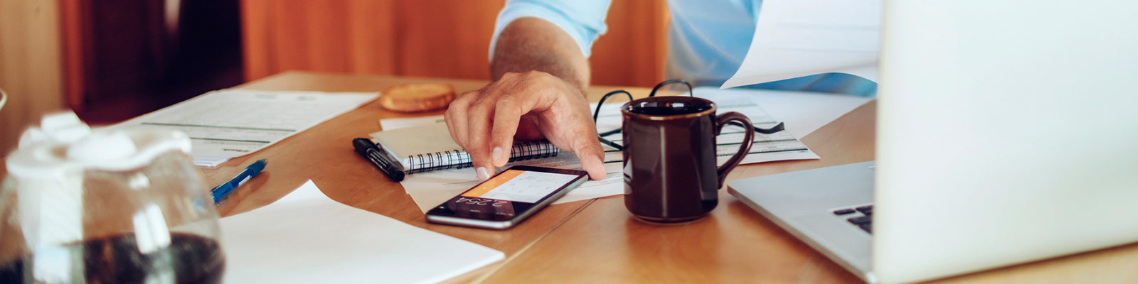 a person using the calculator on their mobile phone