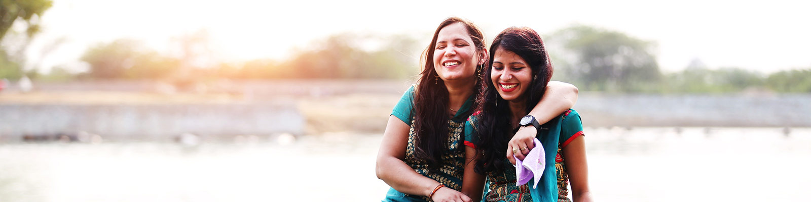 two ladies hugging each other